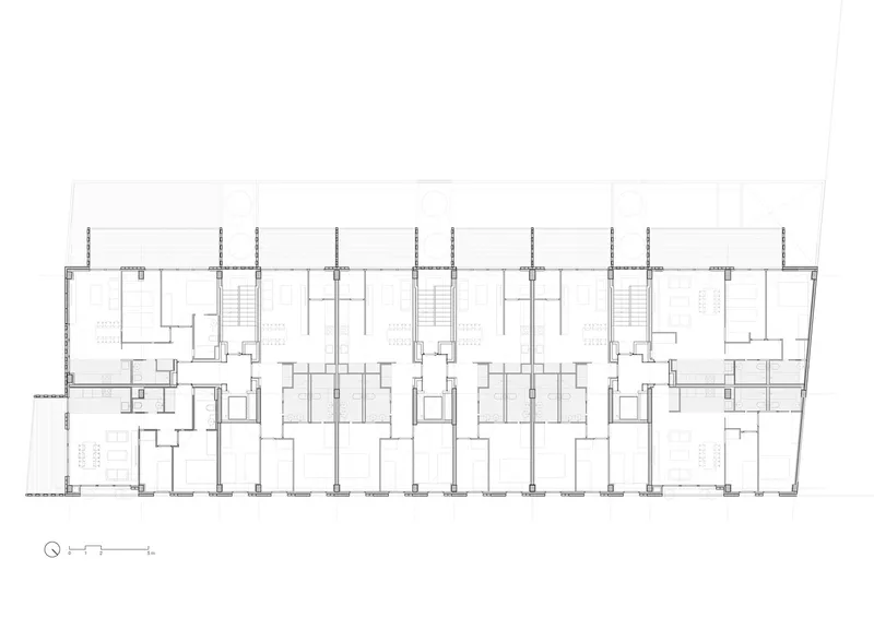 Typical floor plan: seven dwelling units per floor arranged along a central corridor, balconies on the south-west facade, two stair cores