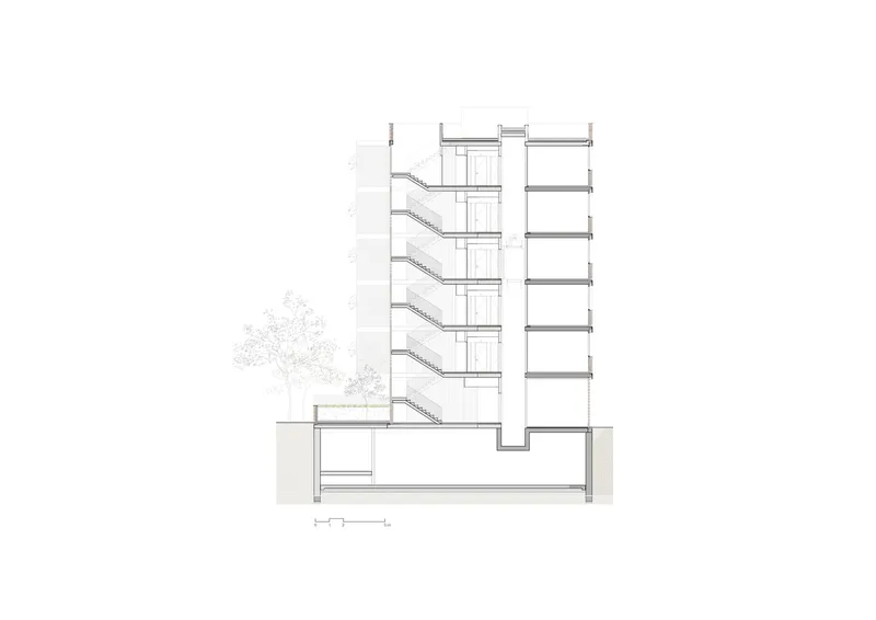 Cross section: basement parking, ground-floor lobby, five residential levels stepping back at the top, stair and lift core at centre