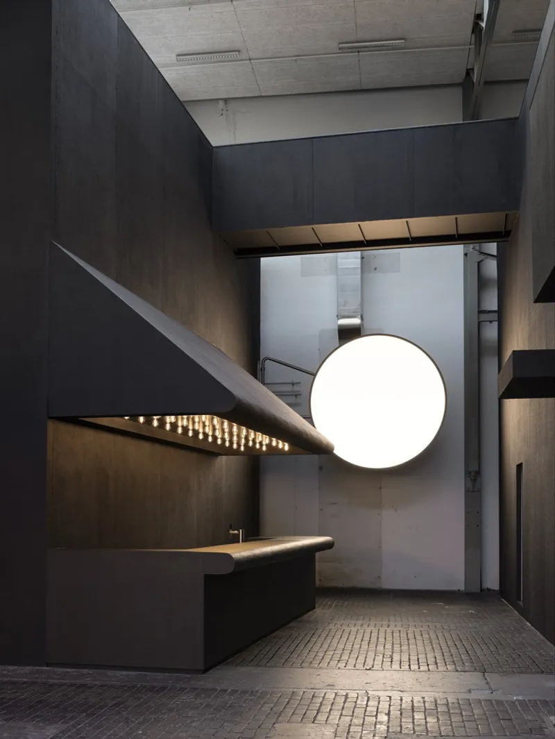 Layered canopy volumes with recessed lighting viewed from the gridded tile floor below