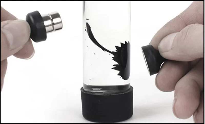 Ferrofluid in a test tube responding to an external magnet, demonstrating how magnetic forces shape fluid material in real time
