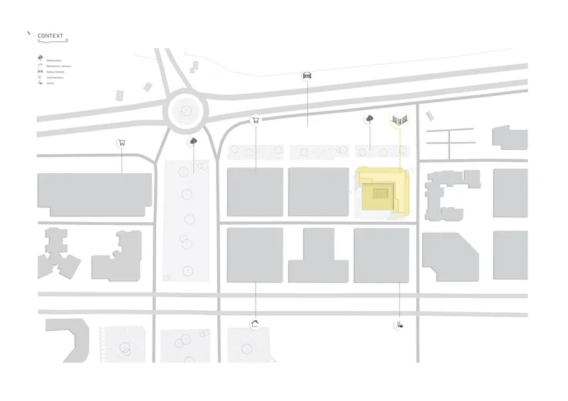 Site plan drawing showing the building footprint highlighted in yellow within the surrounding urban block