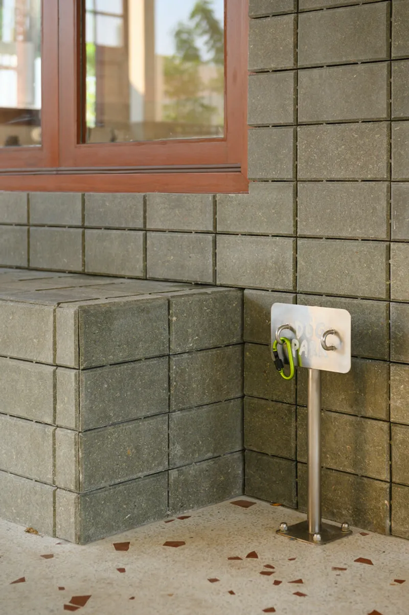 Base detail: concrete block plinth meeting terrazzo floor tiles with coloured aggregate