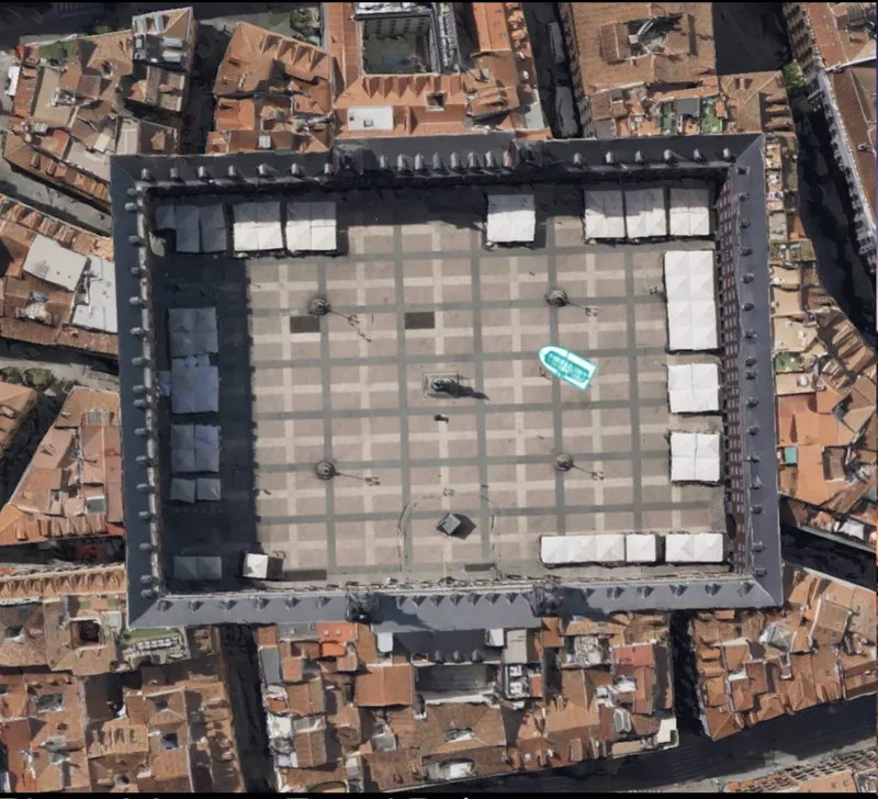 Aerial satellite view of Plaza Mayor with the Ringsail footprint marked in cyan at the centre of the square, showing the scale of the device against the full plaza