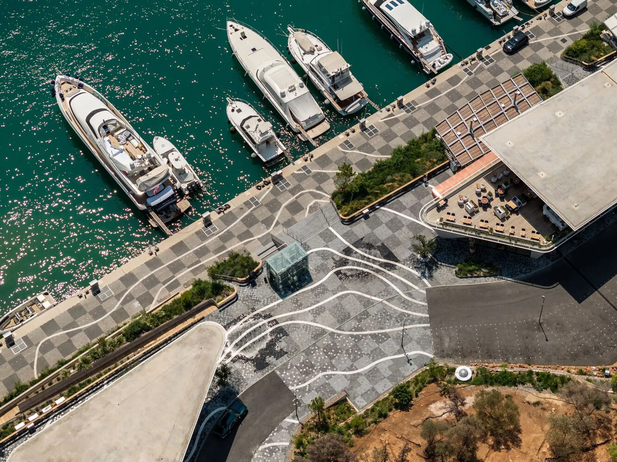 Neiheiser Argyros Weaves a Geological Carpet Along the Athenian Riviera at Astir Marina
