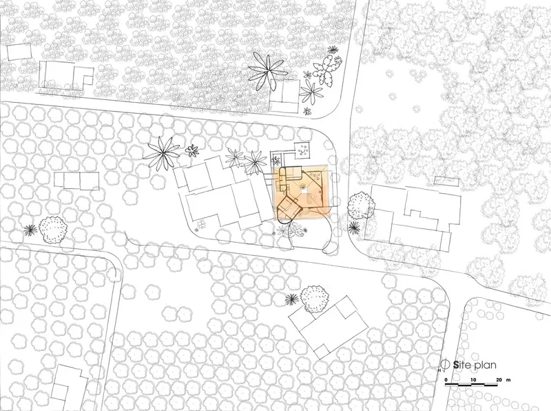 Site plan drawing depicting a building with angular geometry surrounded by scattered trees and neighboring structures