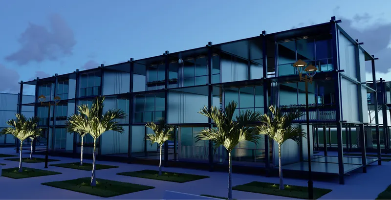 Three-story housing block with exposed steel frame and corrugated metal cladding illuminated at dusk with palm trees