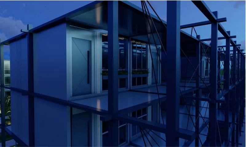 Glass-walled building with exposed steel frame and diagonal bracing captured at dusk
