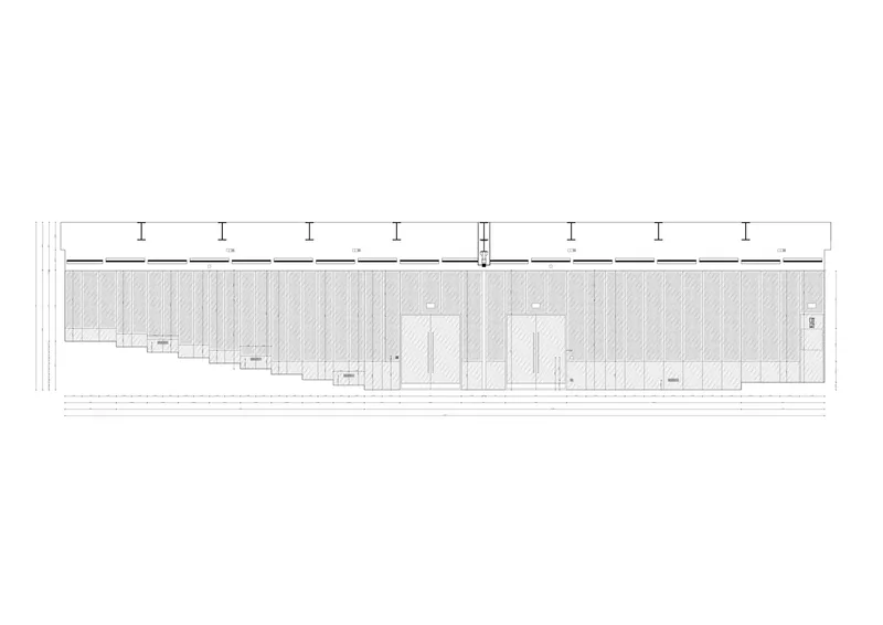 Elevation drawing showing a long facade with vertical mullions and recessed openings at intervals