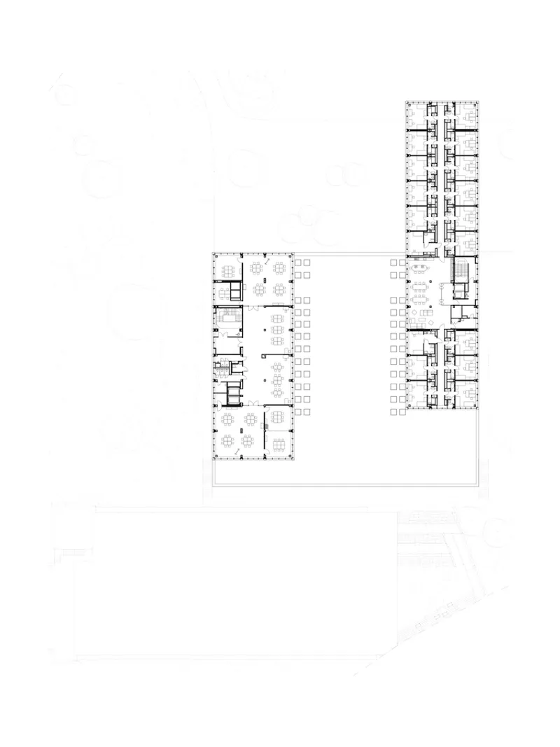 Upper floor plan drawing depicting L-shaped configuration with residential tower and repeating unit layouts
