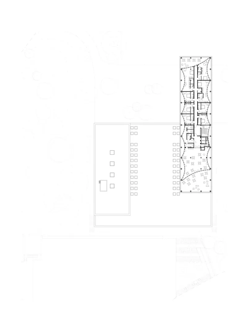 Floor plan drawing showing rooftop level with curved communal space in tower wing