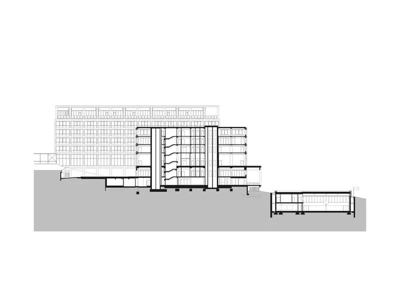 Section drawing showing a multi-story tower with a gridded facade and a lower horizontal wing on sloping terrain