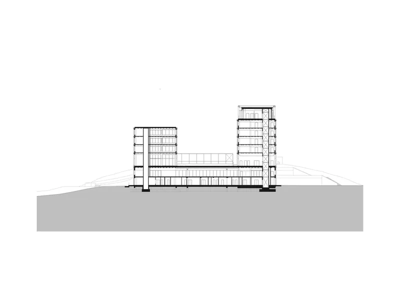 Section drawing depicting two tower volumes connected by a horizontal base element on grade