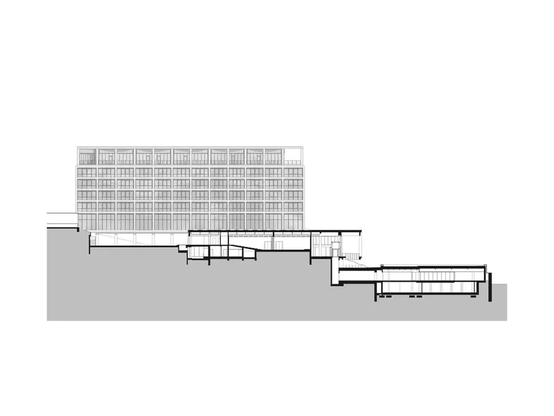 Section drawing showing a residential tower above terraced levels descending the hillside