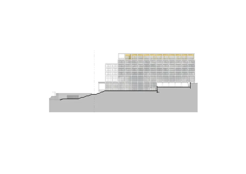 Section drawing showing a tall gridded facade with highlighted yellow apertures above a horizontal base on sloped terrain