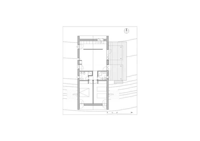 Floor plan drawing showing compact dwelling with central bathroom core and peripheral service spaces
