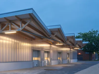 Buro Nord Wraps a Dutch Penitentiary Warehouse in Timber Trusses and Sawtooth Light