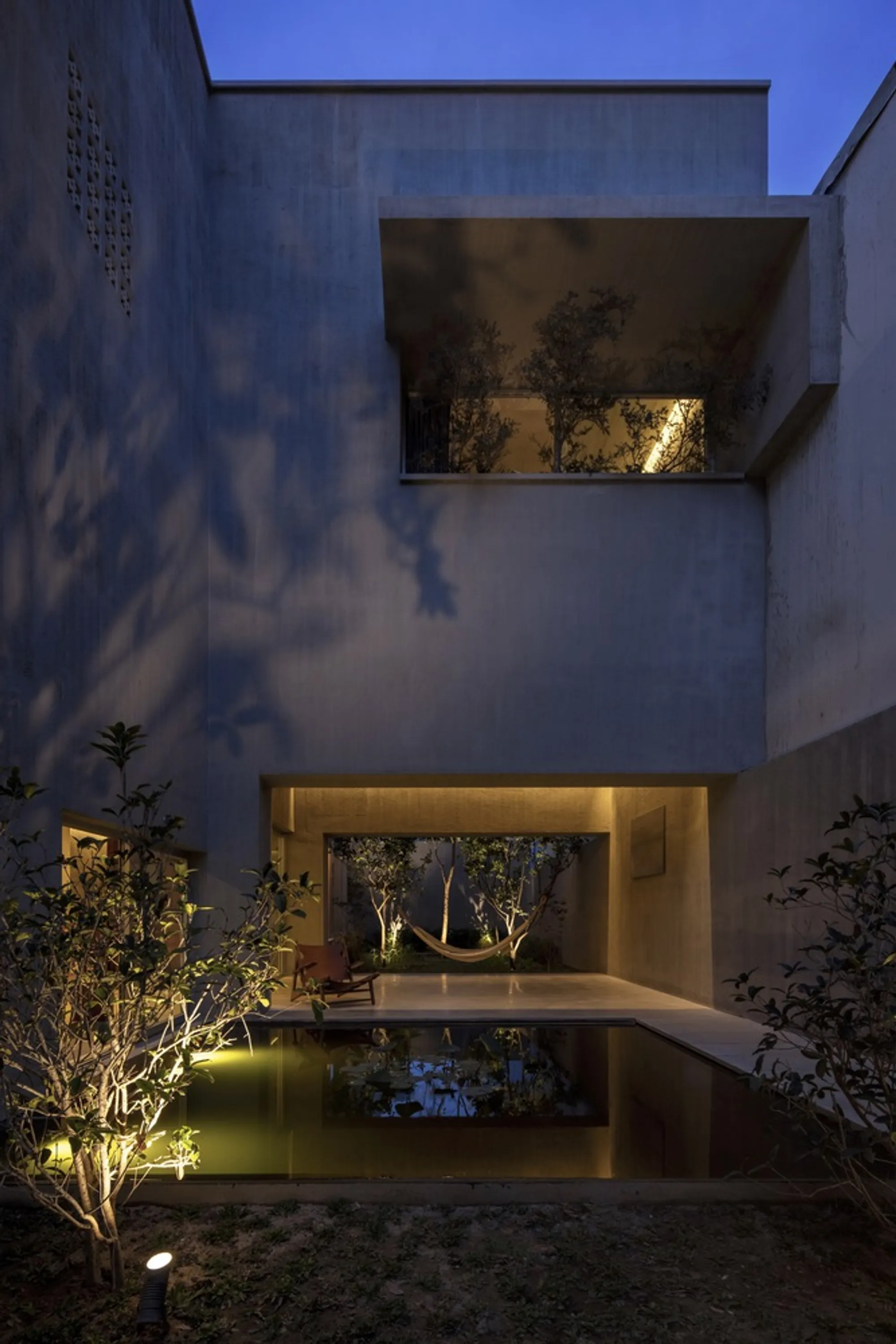 H-H Studio Weaves Courtyards and Concrete into a Layered Family Home in Vietnam