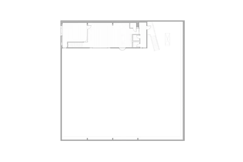Floor plan drawing showing a large square volume with service rooms along the top edge