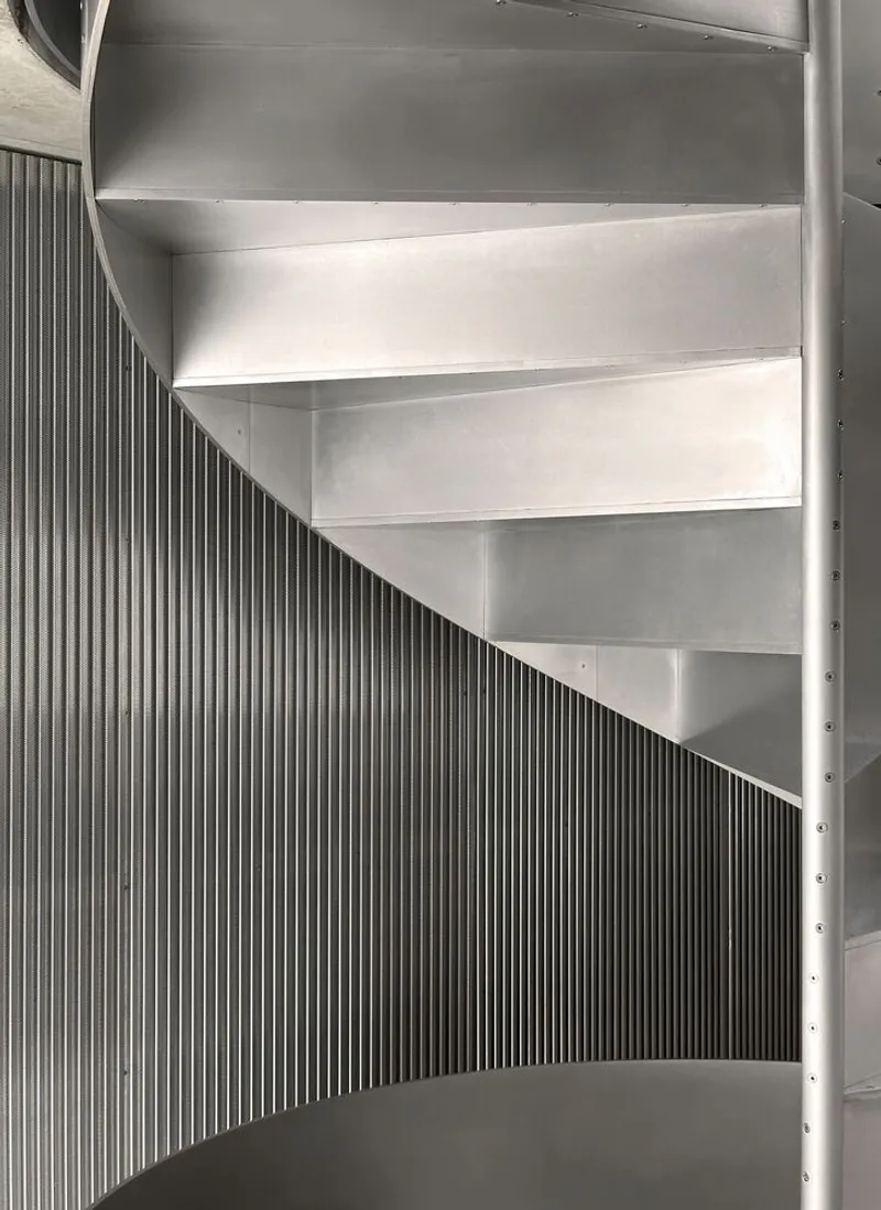 Close-up of the spiral stair's stainless steel treads.