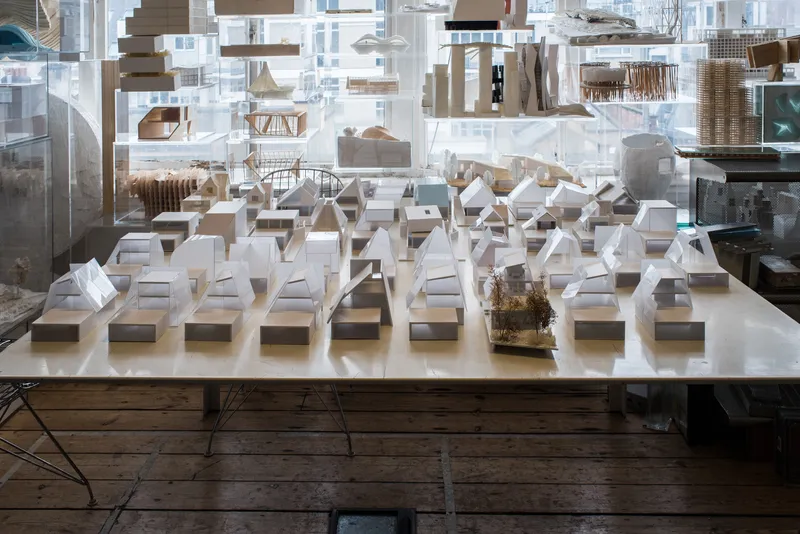 Additional study models on shelves, exploring spatial arrangements.