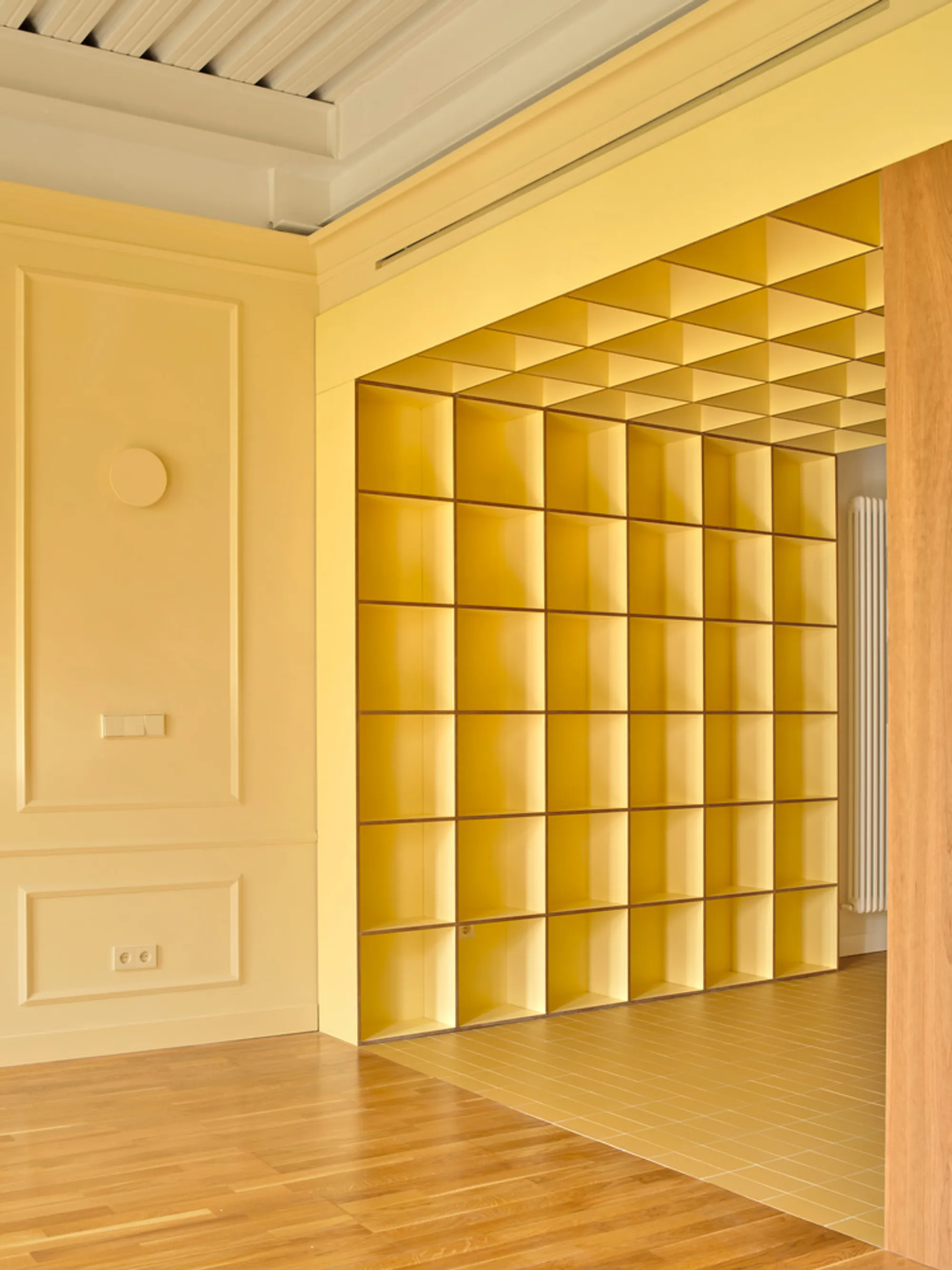 Estudio Gonzalo del Val Rewires a Barcelona Flat with a Yellow Geometric Spine