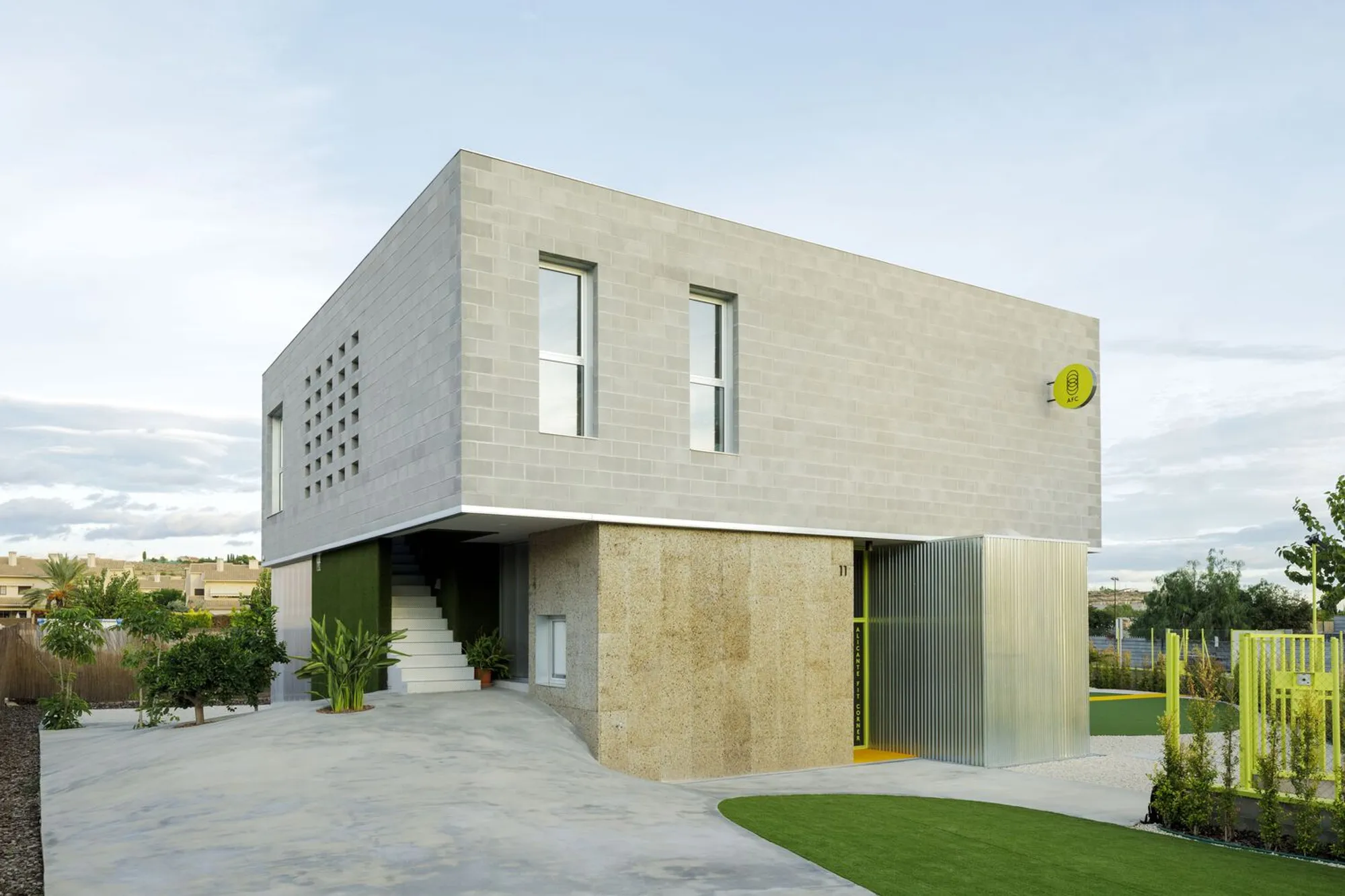 Impepinable Studio Fuses a Gym and a House into One Playful Concrete Block Volume