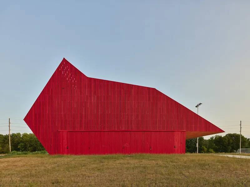 Angular red corrugated envelope with chamfered corner and recessed base