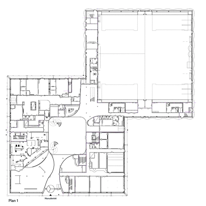 Floor plan drawing showing classrooms and support spaces wrapping around a large multipurpose hall