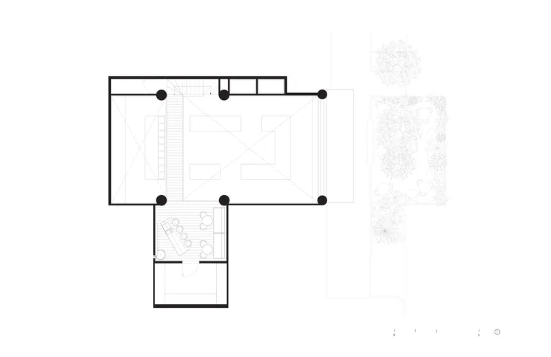 Floor plan drawing showing upper level kitchen workspace with central island and entry vestibule