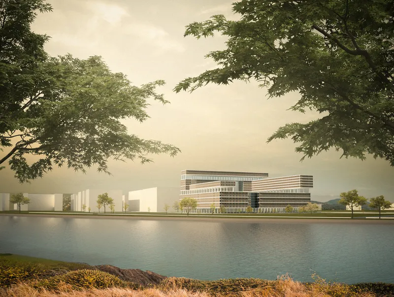 Waterfront view of the horizontal layered facade with overhanging trees framing the composition