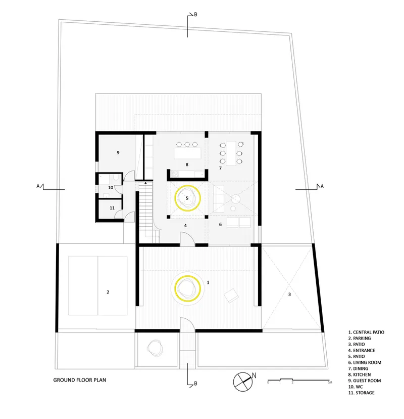 Ground floor plan drawing showing rooms arranged around two circular patios with numbered spaces