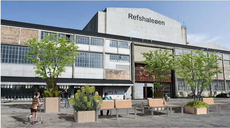 Slatted timber planters and seating arranged in front of a converted industrial warehouse facade