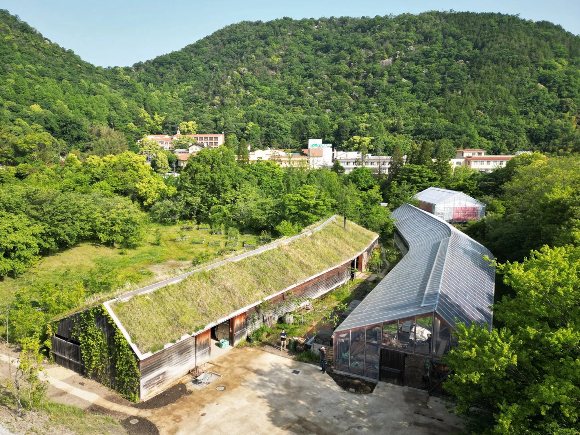 Kyoto University's Global Environmental Lab Plants a Greenhouse That Disappears into a Japanese Valley