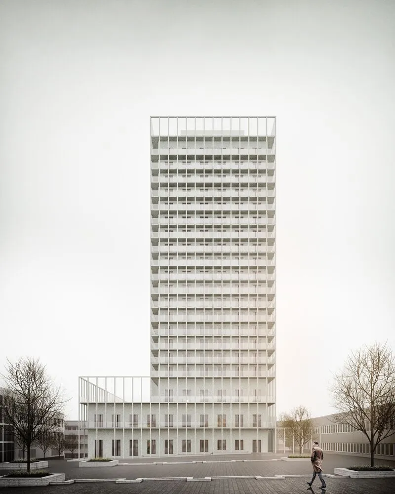 Street-level view of the tower facade with pedestrian crossing under overcast sky