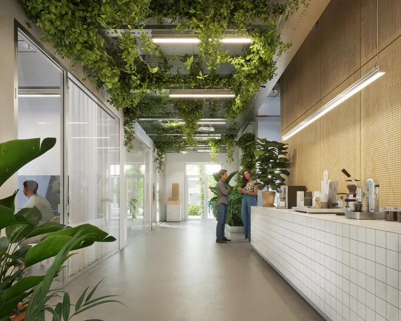 Corridor with white tile service counter, overhead greenery and potted plants beside glazed meeting rooms