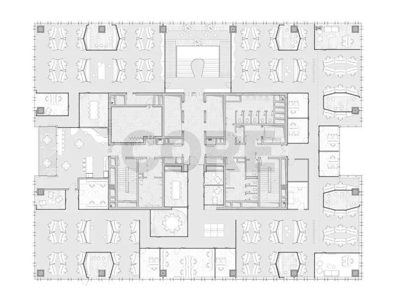 Floor plan drawing showing open office areas surrounding a central core with staircase and support spaces distributed throughout