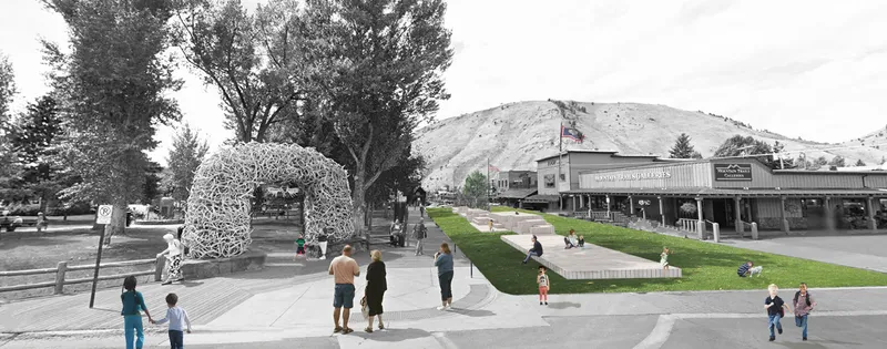 Woven antler arch at the entry to a raised lawn plaza with pedestrians and storefronts