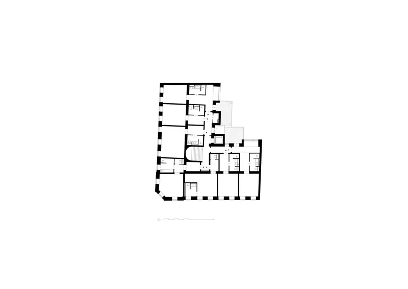 Floor plan drawing showing residential layout with rooms arranged around a central stairwell