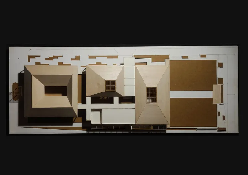 Physical model top view revealing arrangement of pyramidal roof forms and open courtyards