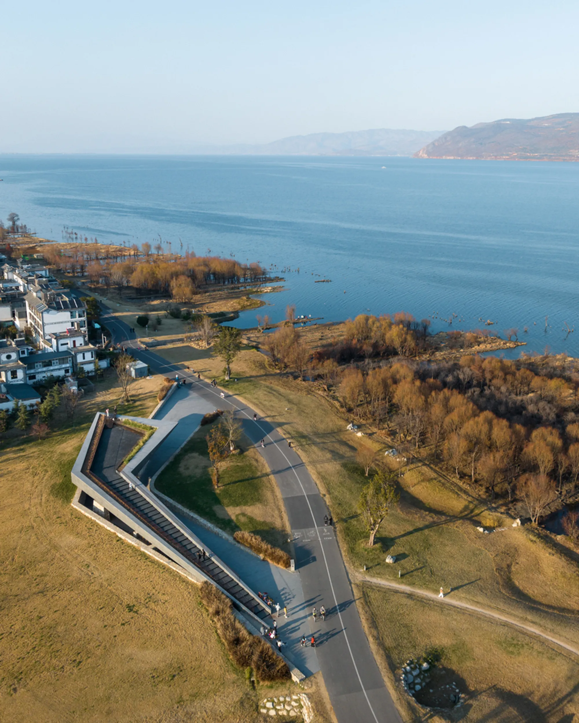 line+ studio Anchors a Folded Concrete Canopy to the Shore of Yunnan's Erhai Lake
