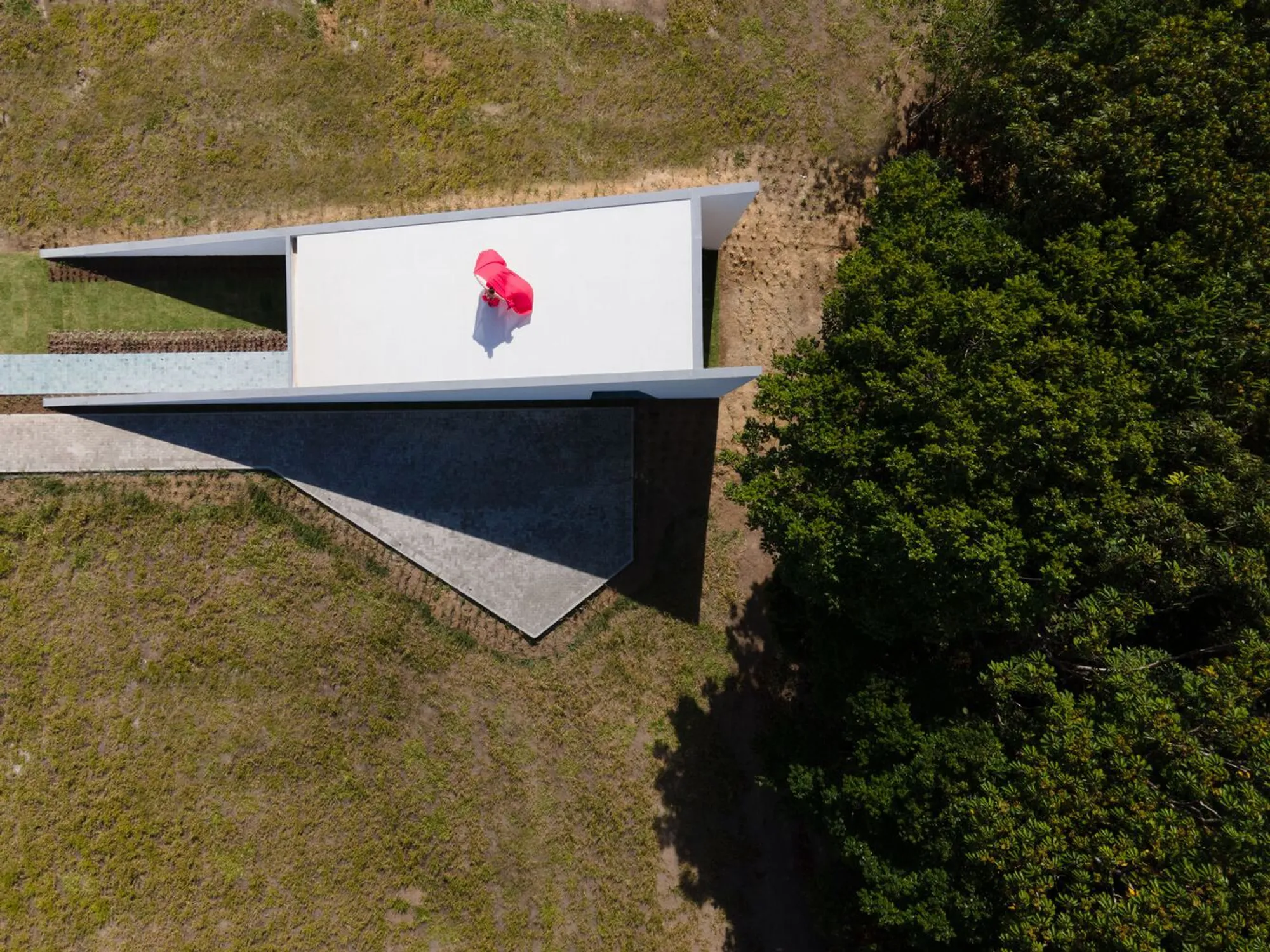 NEBR Arquitetura Folds a White Geometric Temple into the Brazilian Countryside