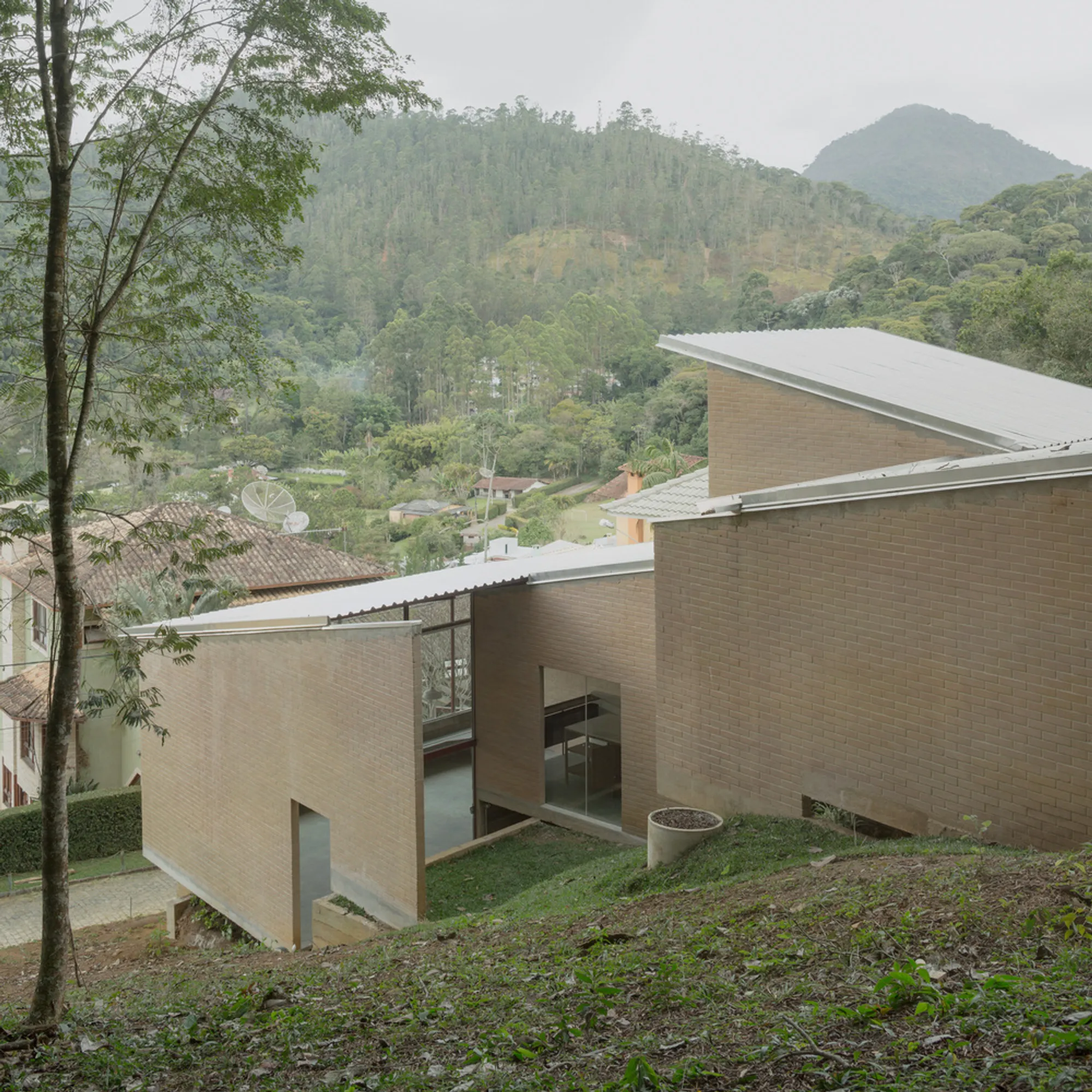 Ayako and Zebulun Step a Brick House Down a Misty Brazilian Hillside