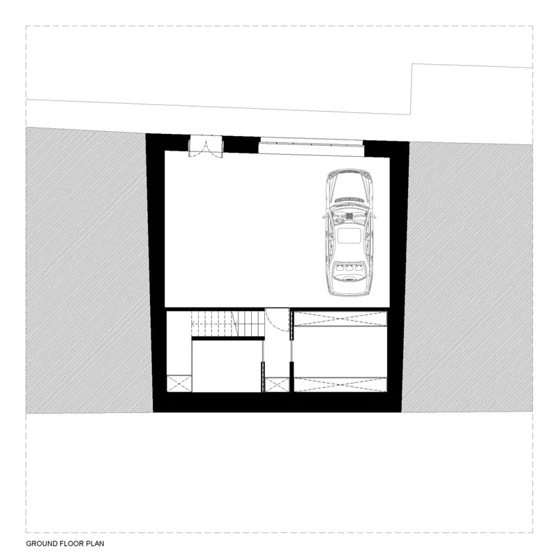 Ground floor plan drawing showing garage space with vehicle and staircase flanked by two smaller rooms