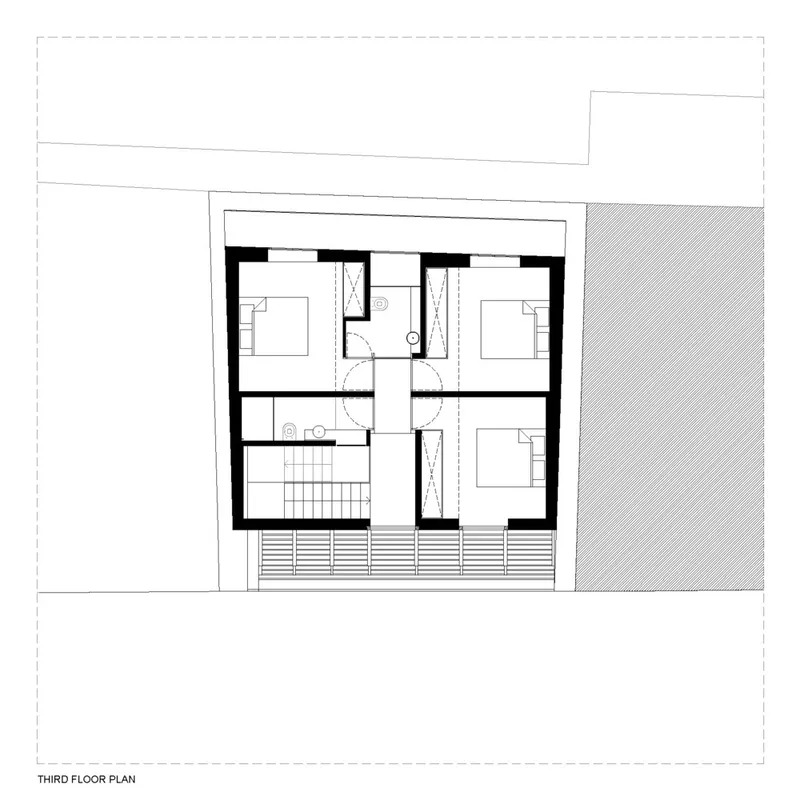 Third floor plan drawing showing three bedrooms, central bathroom and exterior terrace with railing detail