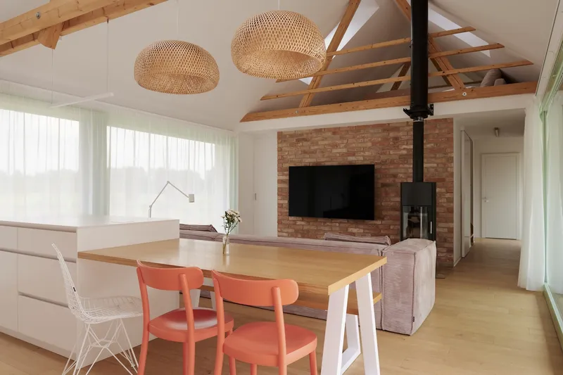 Open living space with exposed timber rafters, brick fireplace wall and woven pendant lights above the dining table