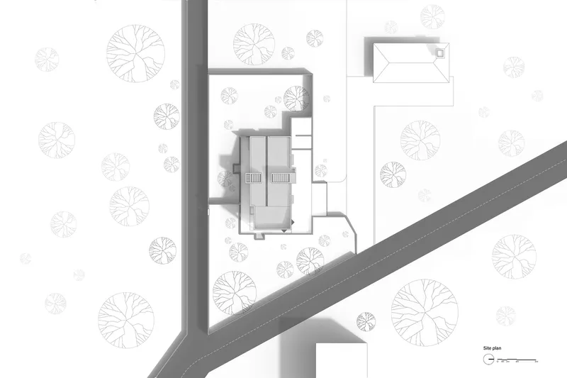 Site plan drawing showing a residence nestled among circular tree canopies near a diagonal roadway