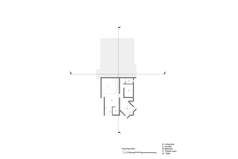 First floor plan drawing showing living area, laundry, bedroom, and therapy room arrangement