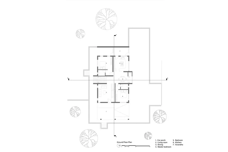 Ground floor plan drawing depicting living spaces, bedrooms, and outdoor terraces surrounded by trees
