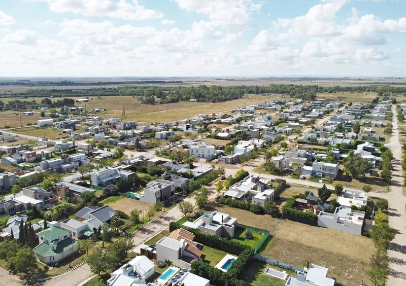Aerial view of the residential neighborhood with scattered houses and tree-lined streets