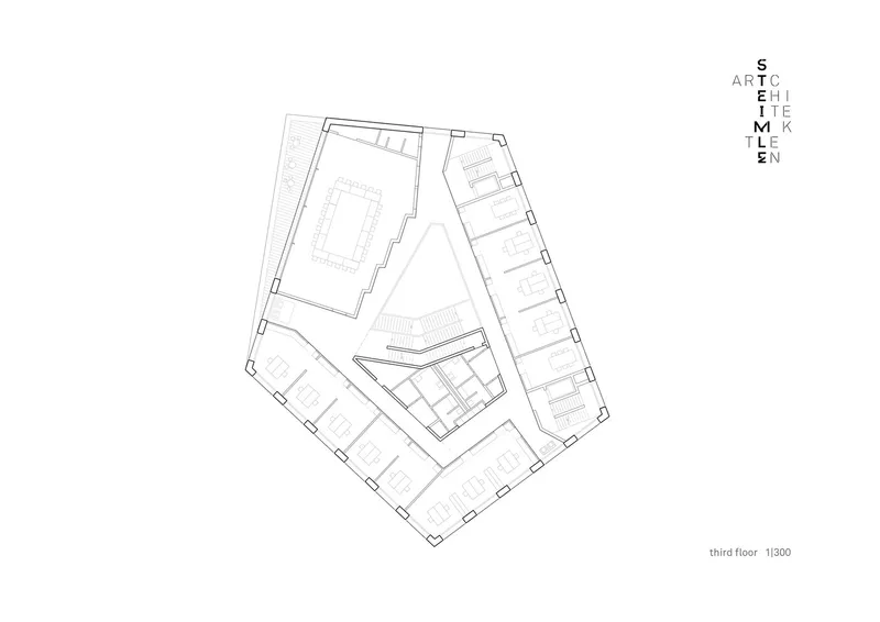 Floor plan drawing showing an irregular pentagonal layout with central atrium and perimeter rooms